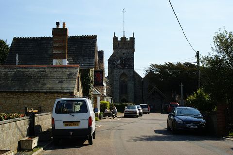 Stone cottages at Church Place, Freshwater, beside All Saints' Church