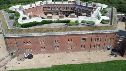 Aerial view of Golden Hill Fort, a Grade I listed Victorian fort in Freshwater converted to homes
