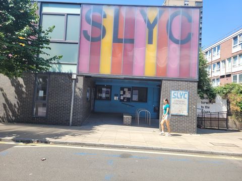 Youth centre building in Camden with a colourful signage panel