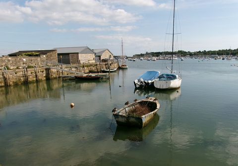 Bembridge Harbour seen from St Helens, with moored boats and harbourside buildings