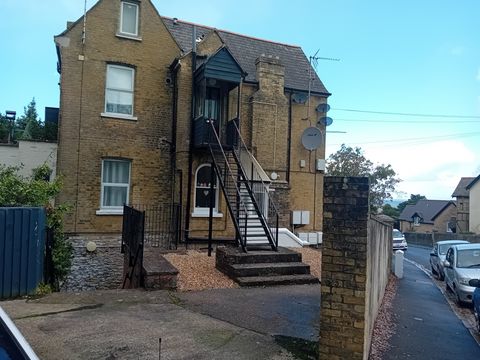 External metal staircase on the side of a stone building in Ryde